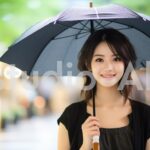 雨の日も楽しむ若い女性