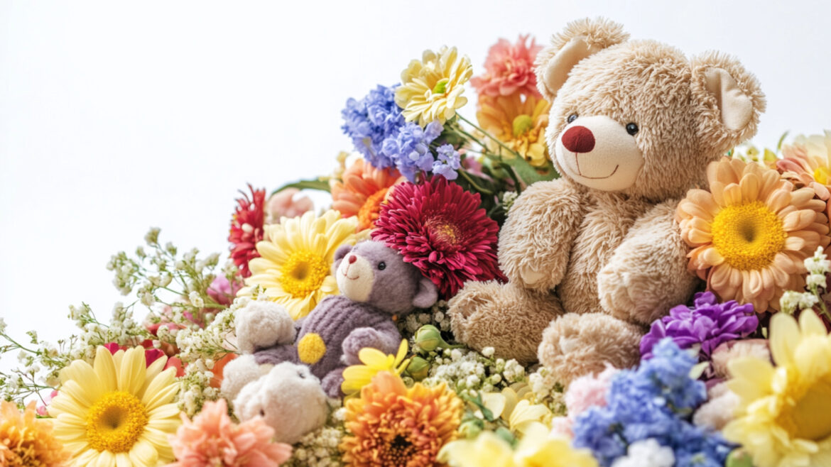 彩りが綺麗な花と熊のぬいぐるみ